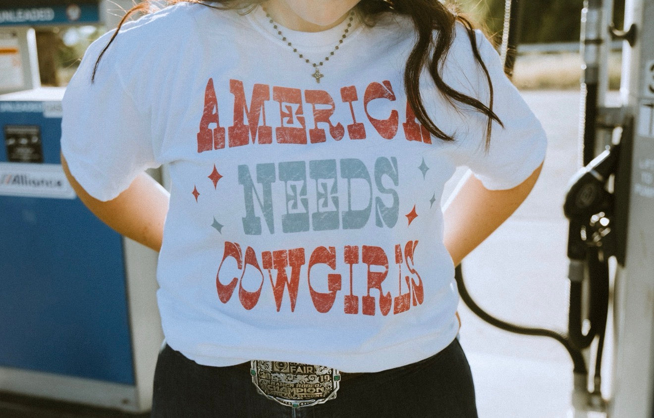 America Needs Cowgirls Tee